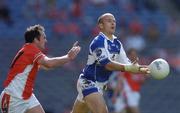 20 August 2005; Tom Kelly, Laois, in action against Aidan O'Rourke, Armagh. Bank of Ireland All-Ireland Senior Football Championship Quarter-Final, Armagh v Laois, Croke Park, Dublin. Picture credit; David Maher / SPORTSFILE