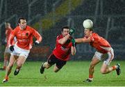 7 February 2014; Kevin McKernan, Down, in action against Tony Kernan and Mark Shields, Armagh. Allianz Football League, Division 2, Round 2, Armagh v Down, Athletic Grounds, Armagh. Picture credit: Oliver McVeigh / SPORTSFILE