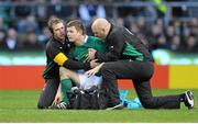27 February 2010; Ireland captain Brian O'Driscoll is held by team physio Cameron Steele and team doctor Dr. Eanna Falvey after falling to the ground twice with suspected concussion during the game. RBS Six Nations Rugby Championship, England v Ireland, Twickenham Stadium, Twickenham, London, England. Picture credit: Brendan Moran / SPORTSFILE
