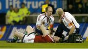 25 June 2005; British and Irish Lions captain Brian O'Driscoll is attended to by team doctor Dr. James Robson, centre, before leaving the field with a suspected dislocated shoulder. British and Irish Lions Tour to New Zealand 2005, 1st Test, New Zealand v British and Irish Lions, Jade Stadium, Christchurch, New Zealand. Picture credit; Brendan Moran / SPORTSFILE