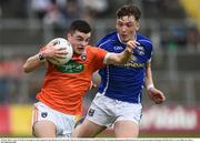 29 May 2016; Conor O'Neill of Armagh in action against Conor Brady of Cavan in the Electric Ireland Ulster GAA Football Minor Championship quarter-final between Cavan and Armagh in Kingspan Breffni Park, Cavan. Photo by Oliver McVeigh/Sportsfile