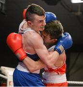 7 March 2014; Tyrone McCullough, left, Holy Family Golden Gloves Boxing Club, exchanges punches with Michael Conlan, St John Bosco Club, during their 56Kg bout. National Senior Boxing Championship Finals, National Stadium, Dublin. Picture credit: Barry Cregg / SPORTSFILE