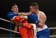 7 March 2014; David Oliver Joyce, right, St Michaels Athy Boxing Club, exchanges punches with Sean McComb, Holy Trinity, during their 60Kg bout. National Senior Boxing Championship Finals, National Stadium, Dublin. Picture credit: Barry Cregg / SPORTSFILE