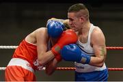 7 March 2014; David Oliver Joyce, right, St Michaels Athy Boxing Club, exchanges punches with Sean McComb, Holy Trinity, during their 60Kg bout. National Senior Boxing Championship Finals, National Stadium, Dublin. Picture credit: Barry Cregg / SPORTSFILE