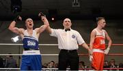 7 March 2014; David Oliver Joyce, left, St Michaels Athy Boxing Club, is declared the winner over Sean McComb, Holy Trinity, after their 60Kg bout. National Senior Boxing Championship Finals, National Stadium, Dublin. Picture credit: Barry Cregg / SPORTSFILE