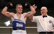 7 March 2014; David Oliver Joyce, St Michaels Athy Boxing Club, is declared the winner over Sean McComb, Holy Trinity, after their 60Kg bout. National Senior Boxing Championship Finals, National Stadium, Dublin. Picture credit: Barry Cregg / SPORTSFILE