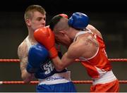 7 March 2014; Chris Phelan, left, Ryston Club, exchanges punches with Adam Courtney, St Marys Dublin Boxing Club, during their 52Kg bout. National Senior Boxing Championship Finals, National Stadium, Dublin. Picture credit: Barry Cregg / SPORTSFILE