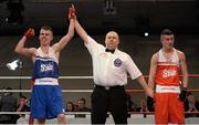 7 March 2014; Chris Phelan, left, Ryston Club, is declared the winner over Adam Courtney, St Marys Dublin Boxing Club, after their 52Kg bout. National Senior Boxing Championship Finals, National Stadium, Dublin. Picture credit: Barry Cregg / SPORTSFILE