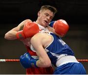 7 March 2014; Michael Nevin, left, Portlaoise Boxing Club, exchanges punches with Dean Walsh, St Josephs / St Ibars Boxing Club, during their 64Kg bout. National Senior Boxing Championship Finals, National Stadium, Dublin. Picture credit: Barry Cregg / SPORTSFILE