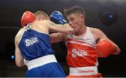 7 March 2014; Michael Nevin, right, Portlaoise Boxing Club, exchanges punches with Dean Walsh, St Josephs / St Ibars Boxing Club, during their 64Kg bout. National Senior Boxing Championship Finals, National Stadium, Dublin. Picture credit: Barry Cregg / SPORTSFILE