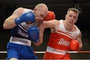 7 March 2014; Gary Sweeney, right, Olympic Boxing Club, exchanges punches with Stephen Ward, Monkstown Antrim Boxing Club, during their 91Kg bout. National Senior Boxing Championship Finals, National Stadium, Dublin. Picture credit: Barry Cregg / SPORTSFILE