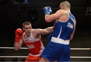 7 March 2014; Con Sheehan, left, Clonmel Boxing Club, exchanges punches with Dean Gardiner, Clonmel Boxing Club, during their 91+Kg bout. National Senior Boxing Championship Finals, National Stadium, Dublin. Picture credit: Barry Cregg / SPORTSFILE