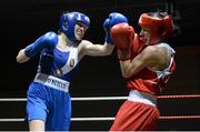 8 March 2014; Michela Walsh, blue, exchanges punches with Dervla Duffy, red, during their 54 Kg bout. National Senior Women's Boxing Championship Finals, National Stadium, Dublin. Picture credit: Matt Browne / SPORTSFILE