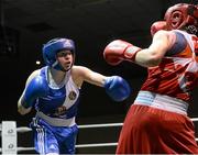 8 March 2014; Amy Broadhurst, blue, exchanges punches with Cheyanne O'Neill, red, during their 60 Kg bout. National Senior Women's Boxing Championship Finals, National Stadium, Dublin. Picture credit: Matt Browne / SPORTSFILE