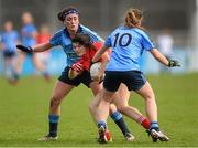 9 March 2014; Maire Ambrose, Cork, in action against Niamh McEvoy, left, and Noelle Healy, 10, Dublin. Tesco Homegrown Ladies National Football League Division 1 Round 5, Dublin v Cork, Parnell Park, Dublin. Picture credit: Pat Murphy / SPORTSFILE