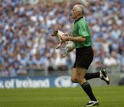 27 August 2005; Referee Gerry Kinneavy removes a dog from the pitch. Bank of Ireland All-Ireland Senior Football Championship Quarter-Final Replay, Dublin v Tyrone, Croke Park, Dublin. Picture credit; Damien Eagers / SPORTSFILE