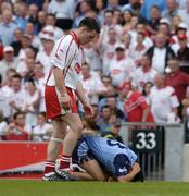 27 August 2005; Conor Gormley, Tyrone, stands over Jason Sherlock, Dublin, at the end of the first half. Bank of Ireland All-Ireland Senior Football Championship Quarter-Final Replay, Dublin v Tyrone, Croke Park, Dublin. Picture credit; David Maher / SPORTSFILE