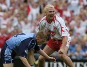 27 August 2005; Owen Mulligan, Tyrone, celebrates after scoring his sides second goal as Stephen O Shaughnessy, Dublin, looks on. Bank of Ireland All-Ireland Senior Football Championship Quarter-Final Replay, Dublin v Tyrone, Croke Park, Dublin. Picture credit; David Maher / SPORTSFILE