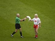 27 August 2005; Owen Mulligan, Tyrone hands over a dog to referee Gerry Kenaevey. Bank of Ireland All-Ireland Senior Football Championship Quarter-Final Replay, Dublin v Tyrone, Croke Park, Dublin. Picture credit; Ray McManus / SPORTSFILE