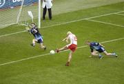 27 August 2005; Owen Mulligan, Tyrone, shoots past Stephen Cluxton in the Dublin goal to score his side's second goal. Bank of Ireland All-Ireland Senior Football Championship Quarter-Final Replay, Dublin v Tyrone, Croke Park, Dublin. Picture credit; Ray McManus / SPORTSFI LE