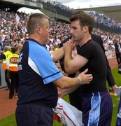 27 August 2005; Dublin's Bryan Cullen is consoled by manager Paul Caffrey at the end of the match. Bank of Ireland All-Ireland Senior Football Championship Quarter-Final Replay, Dublin v Tyrone, Croke Park, Dublin. Picture credit; Damien Eagers / SPORTSFILE