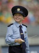 28 August 2005; Seven year old David Moran, Swinford, Co. Mayo, leads the Garda band on the pitch. David who suffers from luekaemia was made a honourary member of the Gardai for a week. Bank of Ireland All-Ireland Senior Football Championship Semi-Final, Kerry v Cork, Croke Park, Dublin. Picture credit; Ray McManus / SPORTSFILE