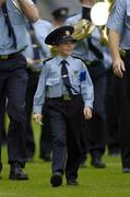 28 August 2005; Seven year old David Moran, Swinford, Co. Mayo, leads the Garda band on the pitch. David who suffers from luekaemia was made a honourary member of the Gardai for a week. Bank of Ireland All-Ireland Senior Football Championship Semi-Final, Kerry v Cork, Croke Park, Dublin. Picture credit; Ray McManus / SPORTSFILE