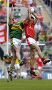 28 August 2005; Kevin MacMahon, Cork, wins an aerial ball against William Kirby, Kerry. Bank of Ireland All-Ireland Senior Football Championship Semi-Final, Kerry v Cork, Croke Park, Dublin. Picture credit; David Maher / SPORTSFILE