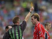 28 August 2005; Brendan Jer O'Sullivan, Cork, is shown the 'yellow card' by referee Joe McQuillan. Bank of Ireland All-Ireland Senior Football Championship Semi-Final, Kerry v Cork, Croke Park, Dublin. Picture credit; Ray McManus / SPORTSFILE