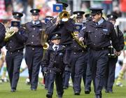28 August 2005; Seven year old David Moran, Swinford, Co. Mayo, along side Sergeant Pat Kenny, as he leads the Garda band. David who suffers from luekaemia was made a honourary member of the Garda for a week. Bank of Ireland All-Ireland Senior Football Championship Semi-Final, Kerry v Cork, Croke Park, Dublin. Picture credit; David Maher / SPORTSFILE