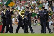 28 August 2005; Seven year old David Moran, Swinford, Co. Mayo, along side Sergeant Pat Kenny, as he leads the Garda band. David who suffers from luekaemia was made a honourary member of the Garda for a week . Bank of Ireland All-Ireland Senior Football Championship Semi-Final, Kerry v Cork, Croke Park, Dublin. Picture credit; Ray McManus / SPORTSFILE