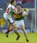 28 August 2005; Gavin Duffy, Kerry, in action against James Noone, Mayo. Minor Football Championship Semi-Final, Kerry v Mayo, Croke Park, Dublin. Picture credit; Ray McManus / SPORTSFILE