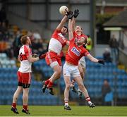 9 March 2014; Mark Lynch, Derry, in action against John McLoughlin and Andrew O'Sullivan, right, Cork. Allianz Football League, Division 1, Round 4, Cork v Derry, Pairc Ui Rinn, Cork. Picture credit: Diarmuid Greene / SPORTSFILE