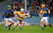 9 March 2014; Conor McGrath, Clare, in action against Paddy Murphy and Shane McGrath, right, Tipperary. Allianz Hurling League, Division 1A, Round 3, Tipperary v Clare, Semple Stadium, Thurles, Co. Tipperary. Picture credit: Brendan Moran / SPORTSFILE