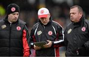 9 March 2014; Tyrone manager Mickey Harte carrying an iPad returns to the dressing rooms at half-time alongside selector Gavin Devlin, left, and coach Fergal McCann, right. Allianz Football League, Division 1, Round 4, Kerry v Tyrone. Fitzgerald Stadium, Killarney, Co. Kerry. Picture credit: Stephen McCarthy / SPORTSFILE