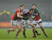 9 March 2014; John Gilligan, Westmeath, in action against Lee Keegan, left, and Kevin McLoughlin, Mayo. Allianz Football League Division 1 Round 4, Westmeath v Mayo, Cusack Park, Mullingar, Co. Westmeath. Photo by Sportsfile