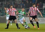 9 March 2014; Gary McCabe, Shamrock Rovers, in action against Barry Molloy, left, and Shane McEleney, Derry City. SSE Airtricity League Premier Division, Shamrock Rovers v Derry City, Tallaght Stadium, Tallaght, Co. Dublin. Picture credit: David Maher / SPORTSFILE