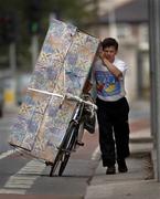 29 August 2005; Mr Edward Jotis adds a new meaning to the biblical term 'Take up thy bed and walk' as he makes his way along Harold's Cross Road, Dublin. Picture credit; Ray McManus / SPORTSFILE