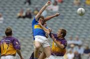 4 September 2005; Tipperary's Aidan Fitzgerald, (backround), punches the ball for a goal supported by team-mate Kevin Mulryan in action against Niall Murphy (17) and Shane Cullen, Wexford. Tommy Murphy Cup Final, Wexford v Tipperary, Croke Park, Dublin. Picture credit; Damien Eagers / SPORTSFILE