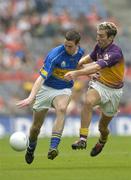 4 September 2005; Robbie Costigan, Tipperary, in action against Redmond Barry, Wexford. Tommy Murphy Cup Final, Wexford v Tipperary, Croke Park, Dublin. Picture credit; Brendan Moran / SPORTSFILE