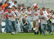4 September 2005; Tyrone supporters charge on to the pitch at the end of the game after victory over Armagh. Bank of Ireland All-Ireland Senior Football Championship Semi-Final, Armagh v Tyrone, Croke Park, Dublin. Picture credit; David Maher / SPORTSFILE