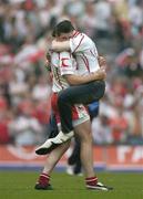 4 September 2005; Sean Cavanagh, Tyrone, is embraced by a fan at the final whistle. Bank of Ireland All-Ireland Senior Football Championship Semi-Final, Armagh v Tyrone, Croke Park, Dublin. Picture credit; Brendan Moran / SPORTSFILE