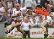 4 September 2005; Peter Canavan, Tyrone, in action against Andy Mallon, Armagh. Bank of Ireland All-Ireland Senior Football Championship Semi-Final, Armagh v Tyrone, Croke Park, Dublin. Picture credit; Brendan Moran / SPORTSFILE