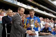 4 September 2005; Declan Browne, Tipperary captain receives the Tommy Murphy Cup from Sean Kelly, President of the GAA. Tommy Murphy Cup Final, Wexford v Tipperary, Croke Park, Dublin. Picture credit; Damien Eagers / SPORTSFILE