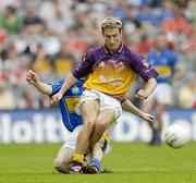 4 September 2005; Redmond Barry, Wexford, is tackled by Brian Mulvihill, Tipperary. Tommy Murphy Cup Final, Wexford v Tipperary, Croke Park, Dublin. Picture credit; Brendan Moran / SPORTSFILE