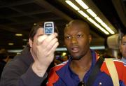 6 September 2005; Djibril Cisse, a member of the French squad, has his photograph taken on a camera phone on arrival at Dublin Airport in advance of the World Cup Qualifying game against the Republic of Ireland. Dublin Airport, Dublin. Picture credit; Damien Eagers / SPORTSFILE