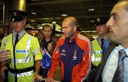 6 September 2005; Zinedine Zidane, a member of the French squad, with Paul Clarke, left, a member of the Airport Police and current selector of the Dublin football team, pictured on arrival at Dublin Airport in advance of the World Cup Qualifying game against the Republic of Ireland. Dublin Airport, Dublin. Picture credit; Damien Eagers / SPORTSFILE