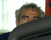 6 September 2005; Raymond Domenech, French football manager, sits on the team bus after arrival at Dublin Airport in advance of the World Cup Qualifying game against the Republic of Ireland. Dublin Airport, Dublin. Picture credit; Damien Eagers / SPORTSFILE