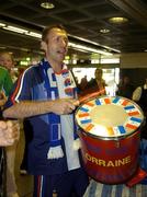 6 September 2005; A French supporter waits for the French team to arrive at Dublin Airport in advance of the World Cup Qualifying game against the Republic of Ireland. Dublin Airport, Dublin. Picture credit; Damien Eagers / SPORTSFILE