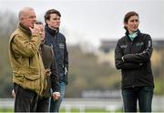 10 March 2014; Trainer Willie Mullins, left, Cheltenham clerk of the course Simon Claisse, second from left, and Gail Carlisle, groom to Hurricane Fly, watch on during the gallops ahead of the Cheltenham Racing Festival 2014. Prestbury Park, Cheltenham, England. Picture credit: Ramsey Cardy / SPORTSFILE